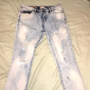 Distressed mid-rise skinny jeans